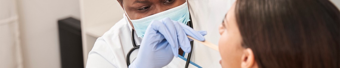 Nurse checking patients mouth