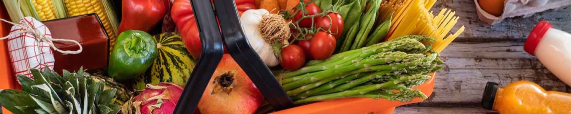 Grocery store basket filled with produce