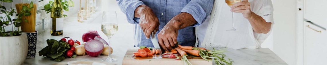 Elderly couple cooking together