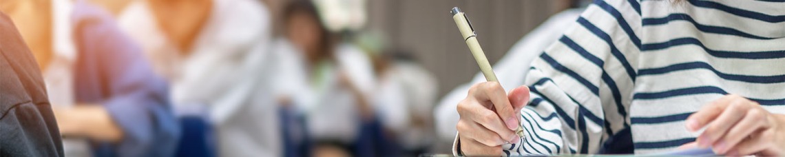 Student in class, writing