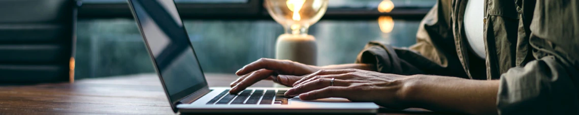 Person typing on laptop