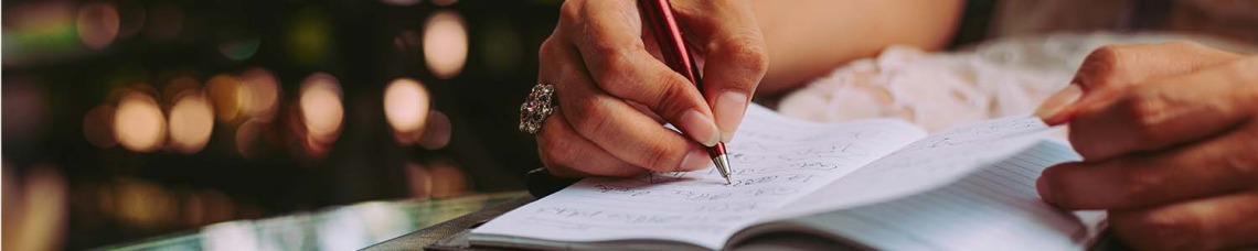 Person writing on paper