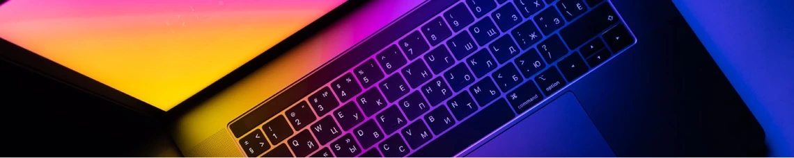Top view of laptop with blue and orange gradient on screen